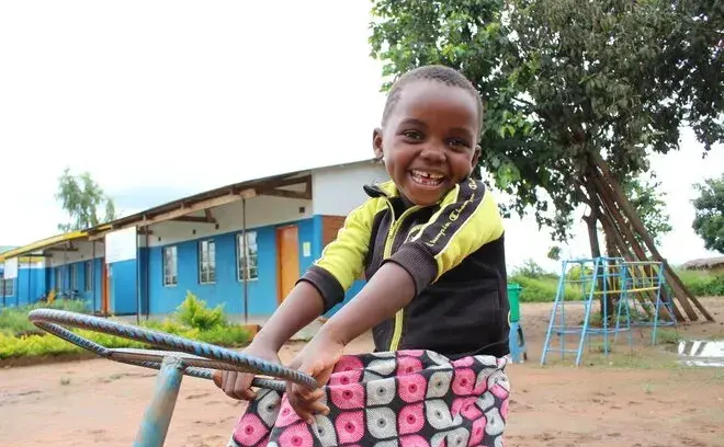 Child playing, Malawi Priorities